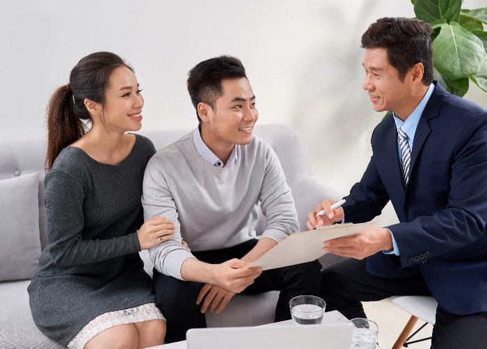Smiling couple happy to know they can optimise their working capital with a business loan from the top money lender in Singapore