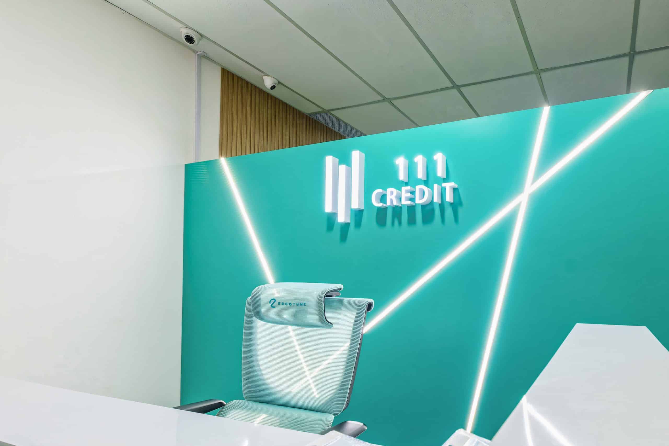 A close up of 111 Credit's logo and reception desk